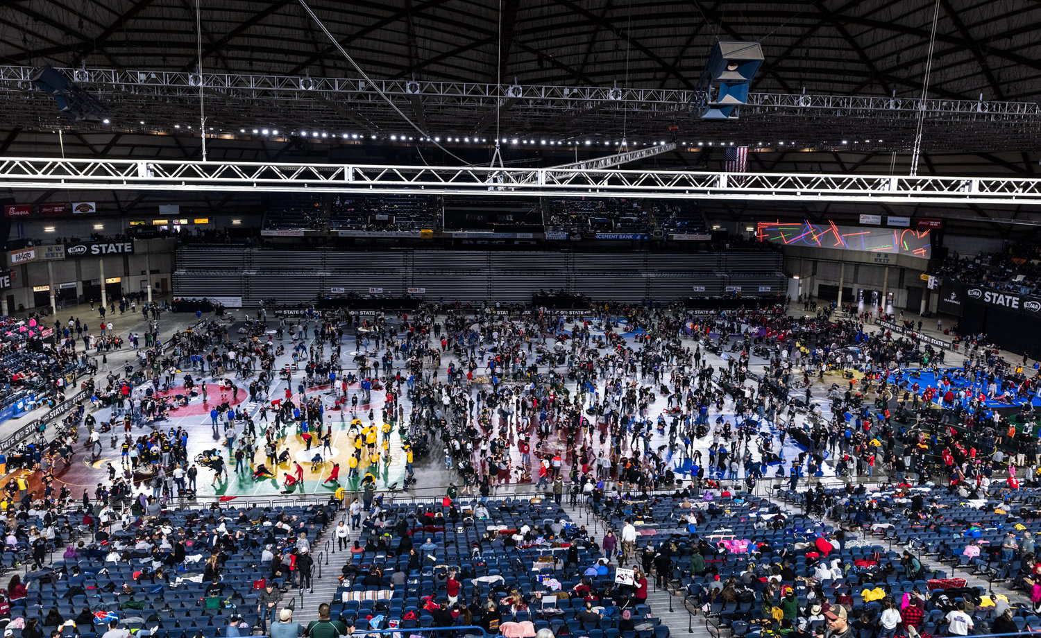 Wrestlers warm up before the start of Mat Classic XXXIV on Friday, February 17, 2023, at the Tacoma Dome. (Joshua Hart/For The Daily News)